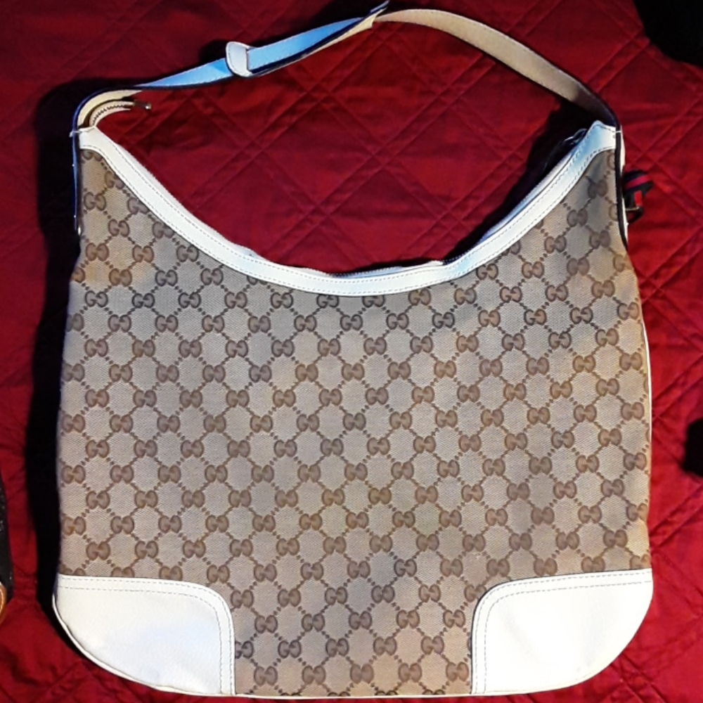 Gucci bag - has very small crack in white leather